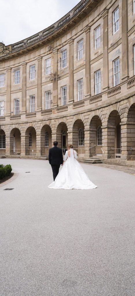 Wedding photography at the Crescent in Buxton, capturing the joy and beauty of a couple in love surrounded by stunning architecture